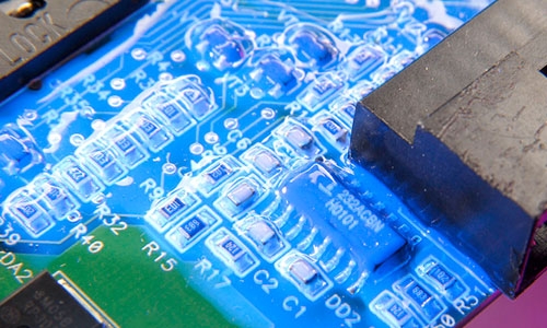 Blue fluorescing conformal coatings can aid in the quality inspection of material coverage.