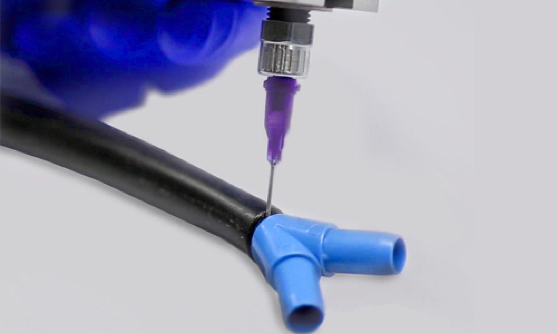 A Dymax 455 Dispensing Valve is used to apply an Hybrid Light-Curable adhesive to substrates.