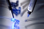Dymax 1202-M-SC MD® Medical Adhesive dispenses blue onto plastic tubing